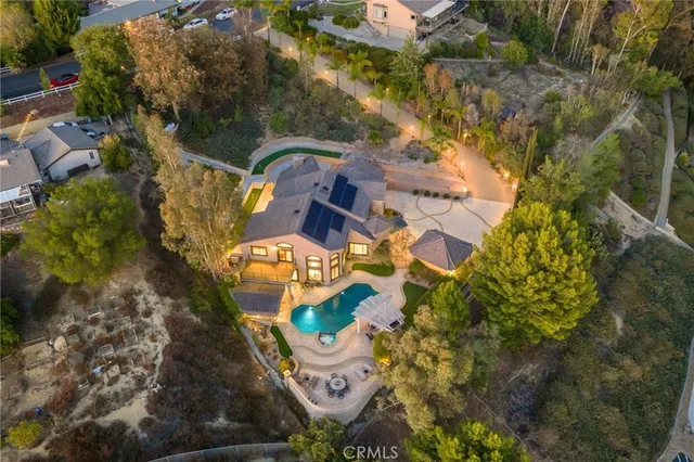 an aerial view of a house with outdoor space