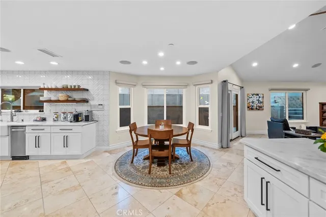 a bedroom with furniture and wooden floor