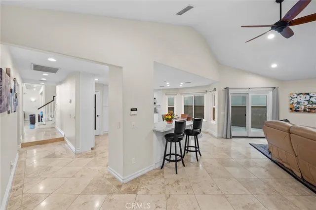 a bathroom with a tub a sink and a window