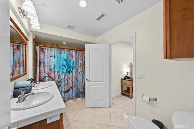 a view of a dinning table and chairs on the roof deck