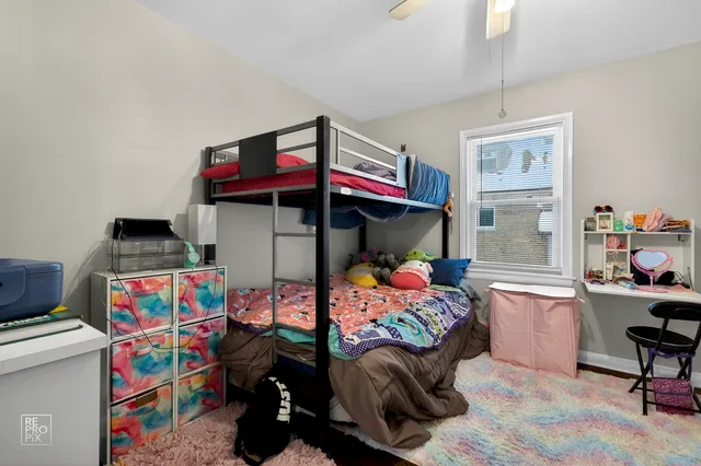 a bedroom with furniture and a window