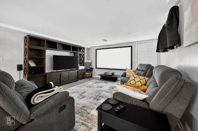 a bedroom with a bed and a view of living room