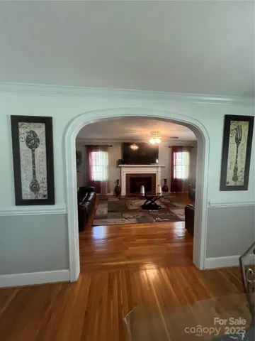 a living room with furniture flat screen tv and a fireplace