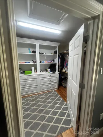 a front view of house with yard and trees