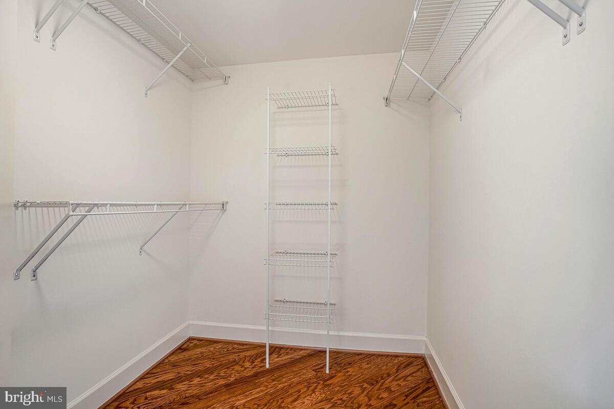 11800 Sunset Hills Road, Unit 514 Reston, VA 20190 - Photo 53 of 57 a view of walk in closet with empty racks