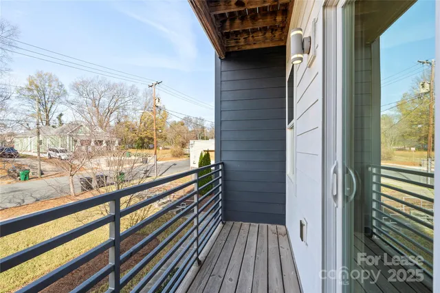 a view of balcony with wooden floor