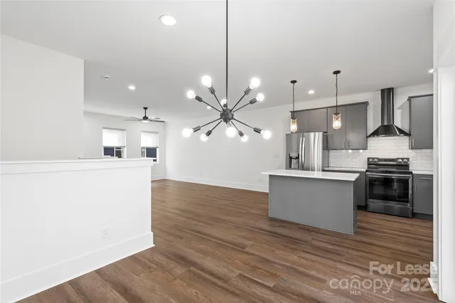 a view of a kitchen with a sink and a stove