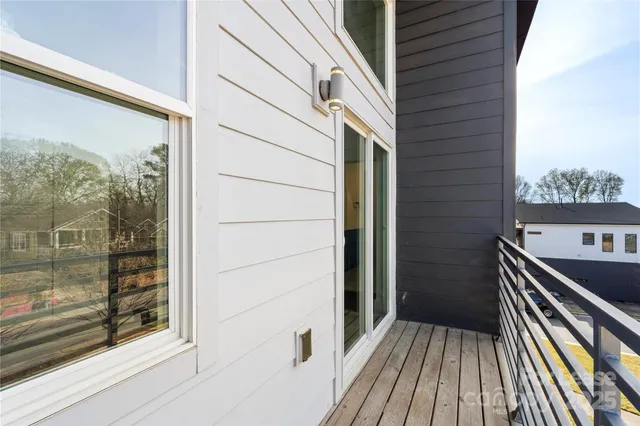a view of balcony and wooden floor