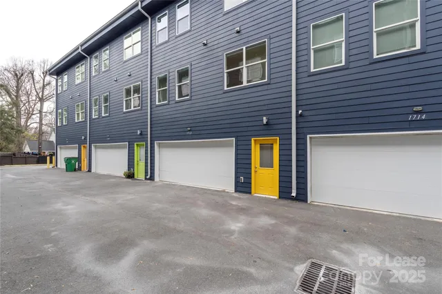 a view of a house with a yard and garage