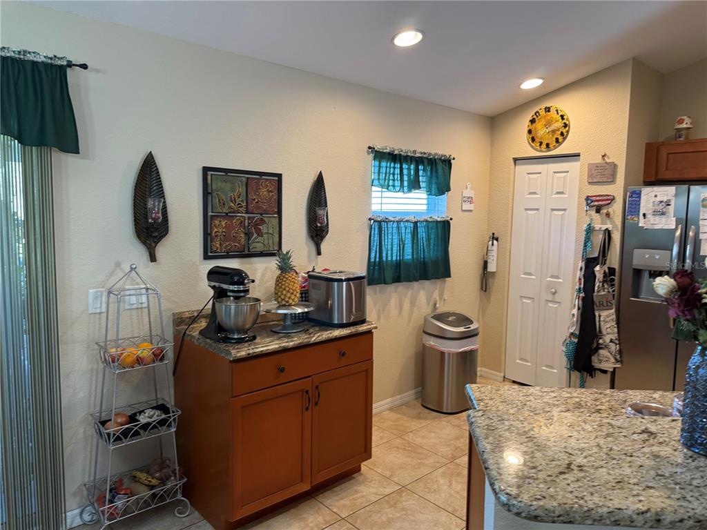137 Juniper Loop Ocala, FL 34480 - Photo 13 of 28 a kitchen with a refrigerator and a sink