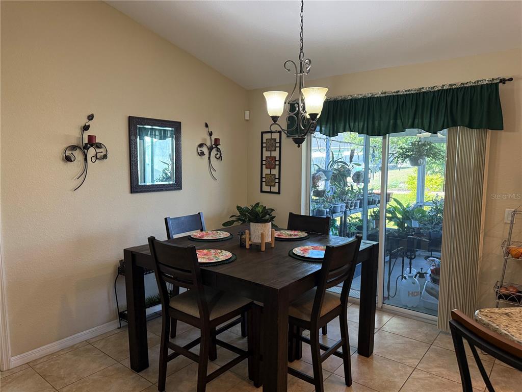 137 Juniper Loop Ocala, FL 34480 - Photo 14 of 28 a view of a dining room with furniture window and outside view