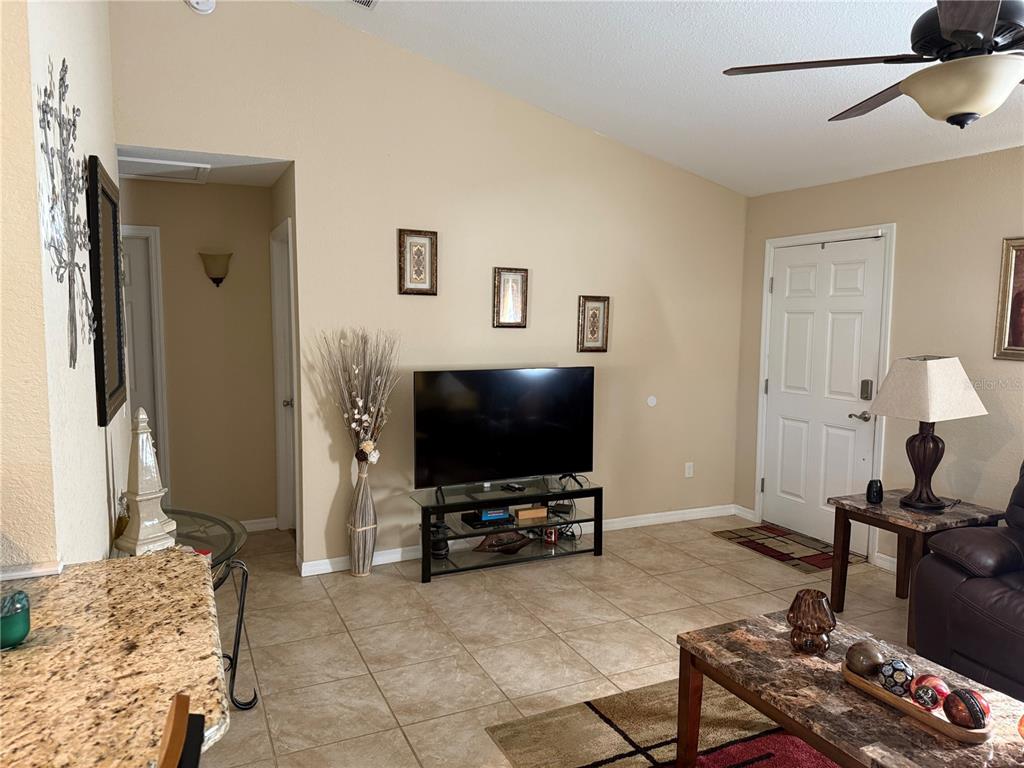 137 Juniper Loop Ocala, FL 34480 - Photo 15 of 28 a living room with furniture and a flat screen tv