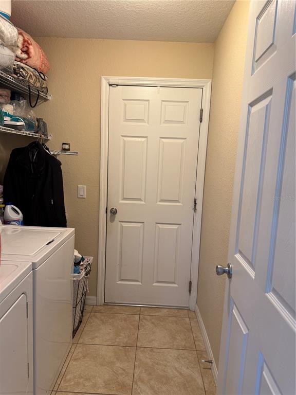 137 Juniper Loop Ocala, FL 34480 - Photo 17 of 28 a utility room with dryer and washer