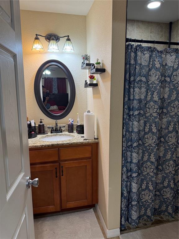 137 Juniper Loop Ocala, FL 34480 - Photo 18 of 28 a bathroom with a sink a toilet and a shower