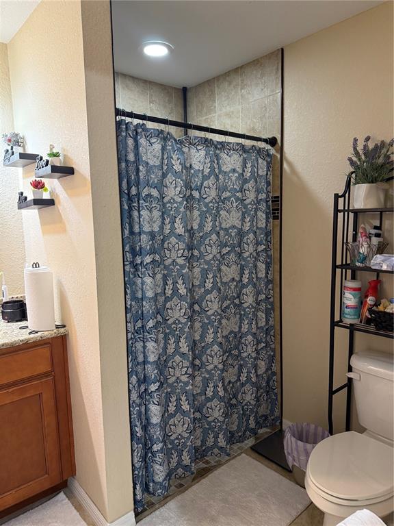 137 Juniper Loop Ocala, FL 34480 - Photo 19 of 28 a bathroom with a toilet and shower