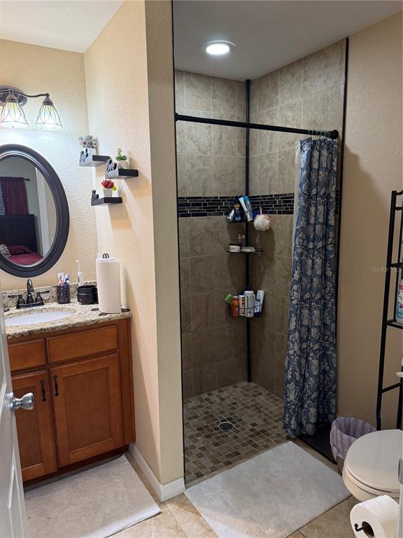 137 Juniper Loop Ocala, FL 34480 - Photo 20 of 28 a bathroom with a sink a toilet and shower
