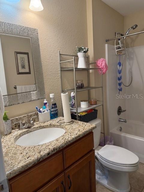137 Juniper Loop Ocala, FL 34480 - Photo 24 of 28 a bathroom with a granite countertop sink toilet and shower