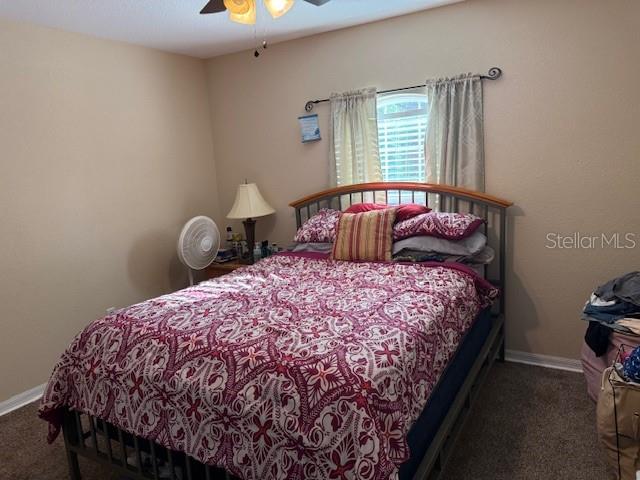 137 Juniper Loop Ocala, FL 34480 - Photo 28 of 28 a bedroom with a bed and a window