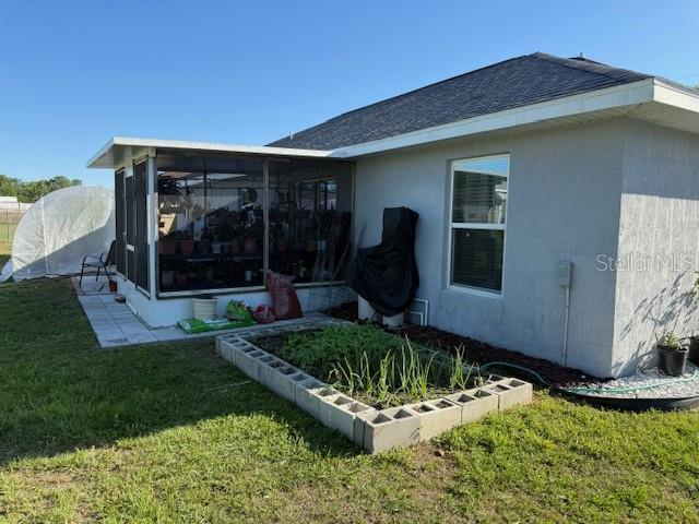 137 Juniper Loop Ocala, FL 34480 - Photo 10 of 28 a front view of a house with garden