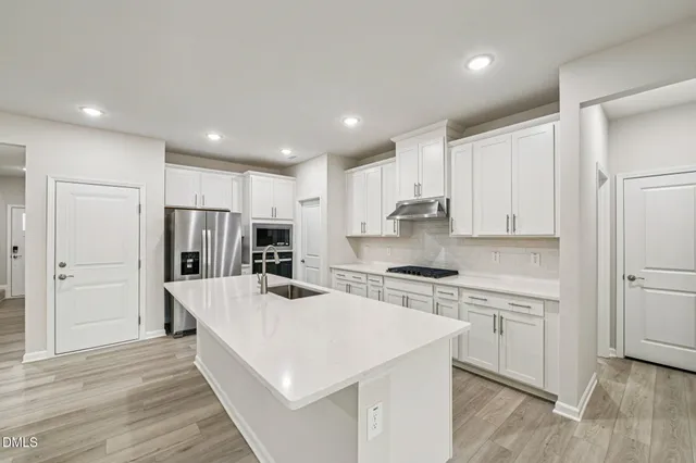 a bathroom with a sink double vanity and a mirror
