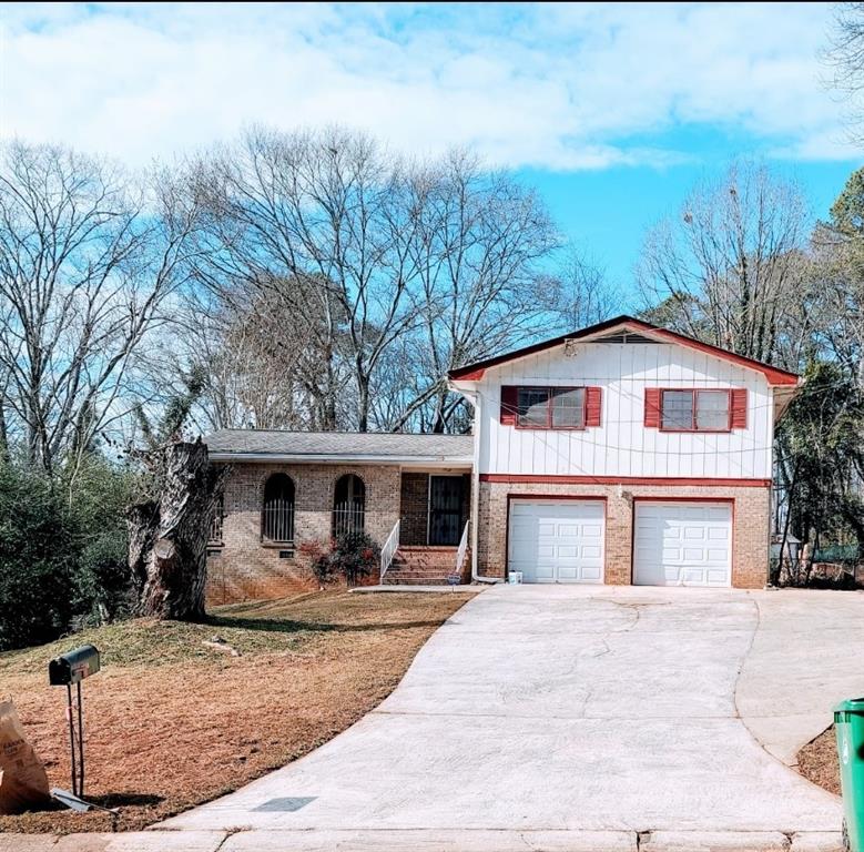 1108 Melrose Drive Clarkston, GA 30021 - Photo 1 of 1 a front view of a house with garden