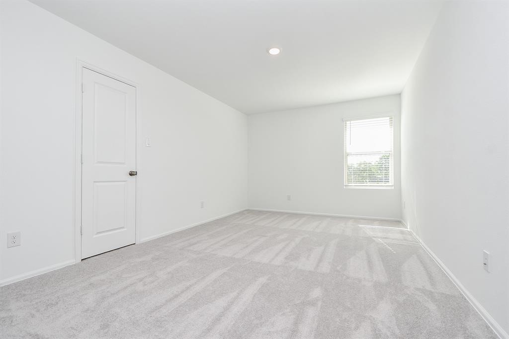 2932 Tantara Drive Katy, TX 77493 - Photo 11 of 34 an empty room with a window