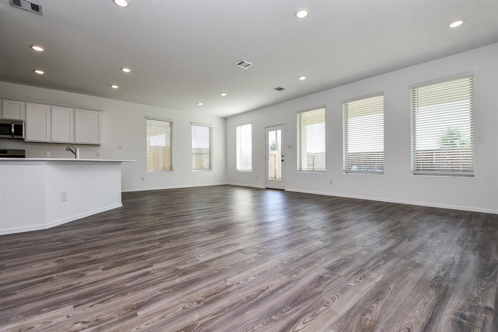 2932 Tantara Drive Katy, TX 77493 - Photo 15 of 34 a view of an empty room with wooden floor and a window