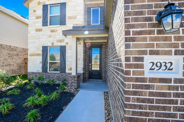 a view of a brick building with a bench