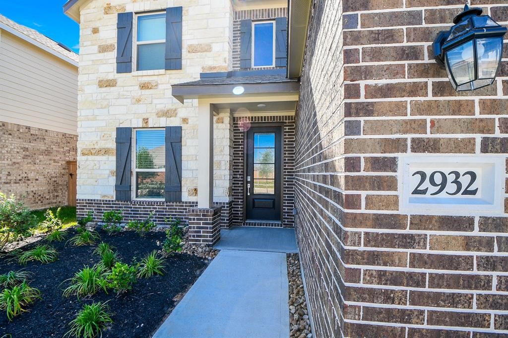 2932 Tantara Drive Katy, TX 77493 - Photo 2 of 34 a view of a brick building with a bench