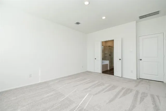 a white bath tub sitting next to a window