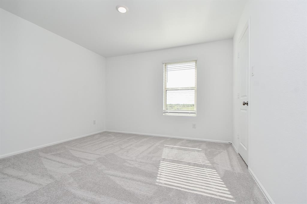 2932 Tantara Drive Katy, TX 77493 - Photo 24 of 34 an empty room with a window