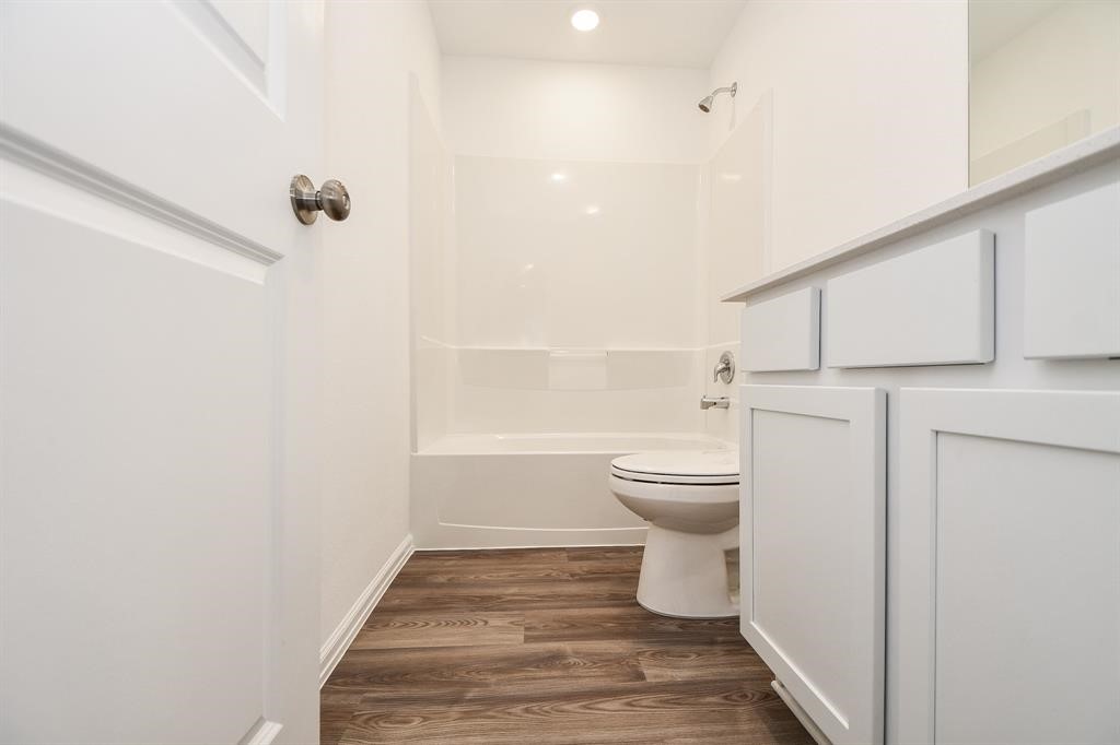 2932 Tantara Drive Katy, TX 77493 - Photo 25 of 34 a bathroom with a toilet and a shower