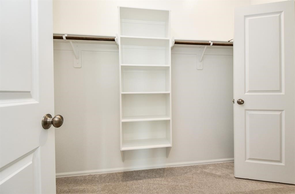 2932 Tantara Drive Katy, TX 77493 - Photo 27 of 34 a view of a room with rack on the wall