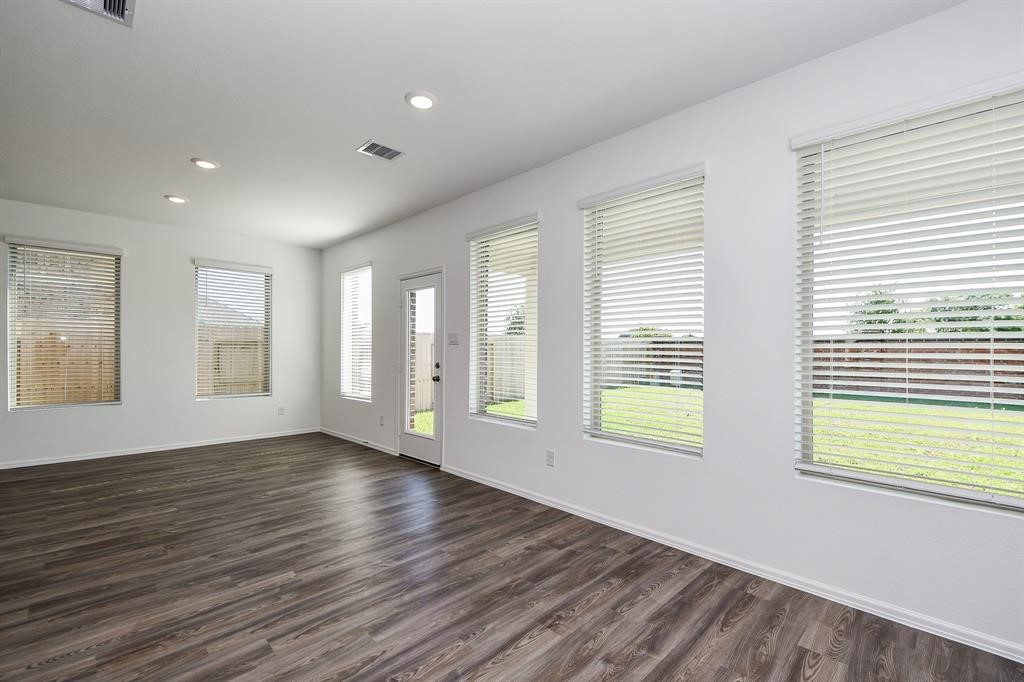 2932 Tantara Drive Katy, TX 77493 - Photo 28 of 34 a view of an empty room with wooden floor and a window