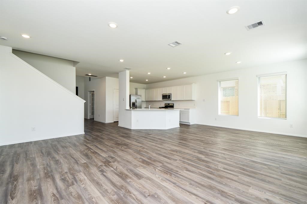 2932 Tantara Drive Katy, TX 77493 - Photo 8 of 34 a view of kitchen with wooden floor and a window