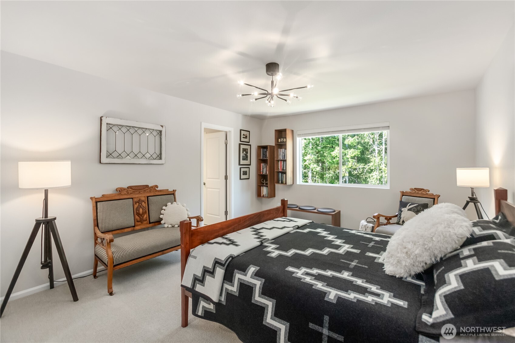 111 Northeast Ridgetop Crossing Belfair, WA 98528 - Photo 20 of 40 a bed room with a bed and a couch