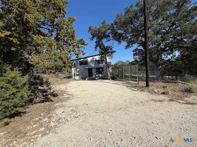 a view of balcony with wooden floor and outdoor seating