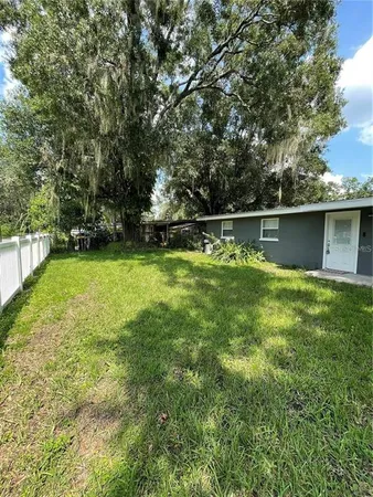 a view of swimming pool with a yard