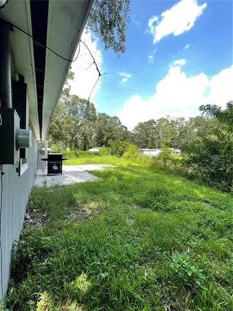 a view of outdoor space and yard
