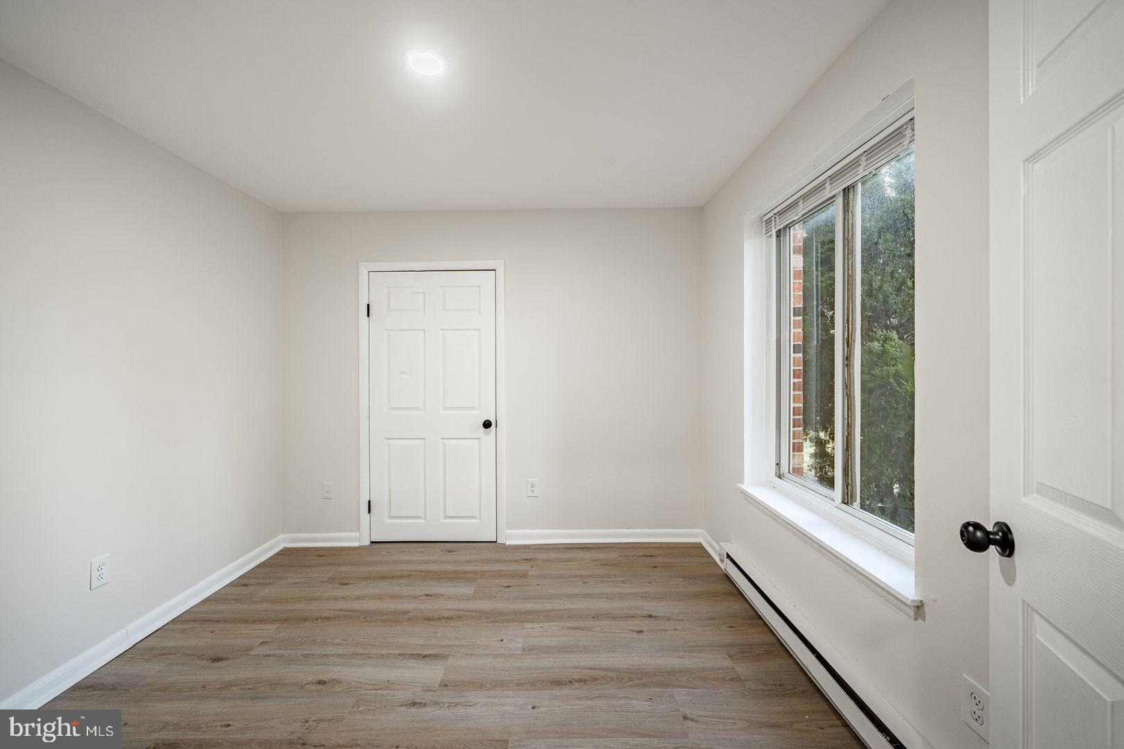 300 North Penn Street, Unit W9 West Chester, PA 19380 - Photo 6 of 9 a view of an empty room with wooden floor and a window
