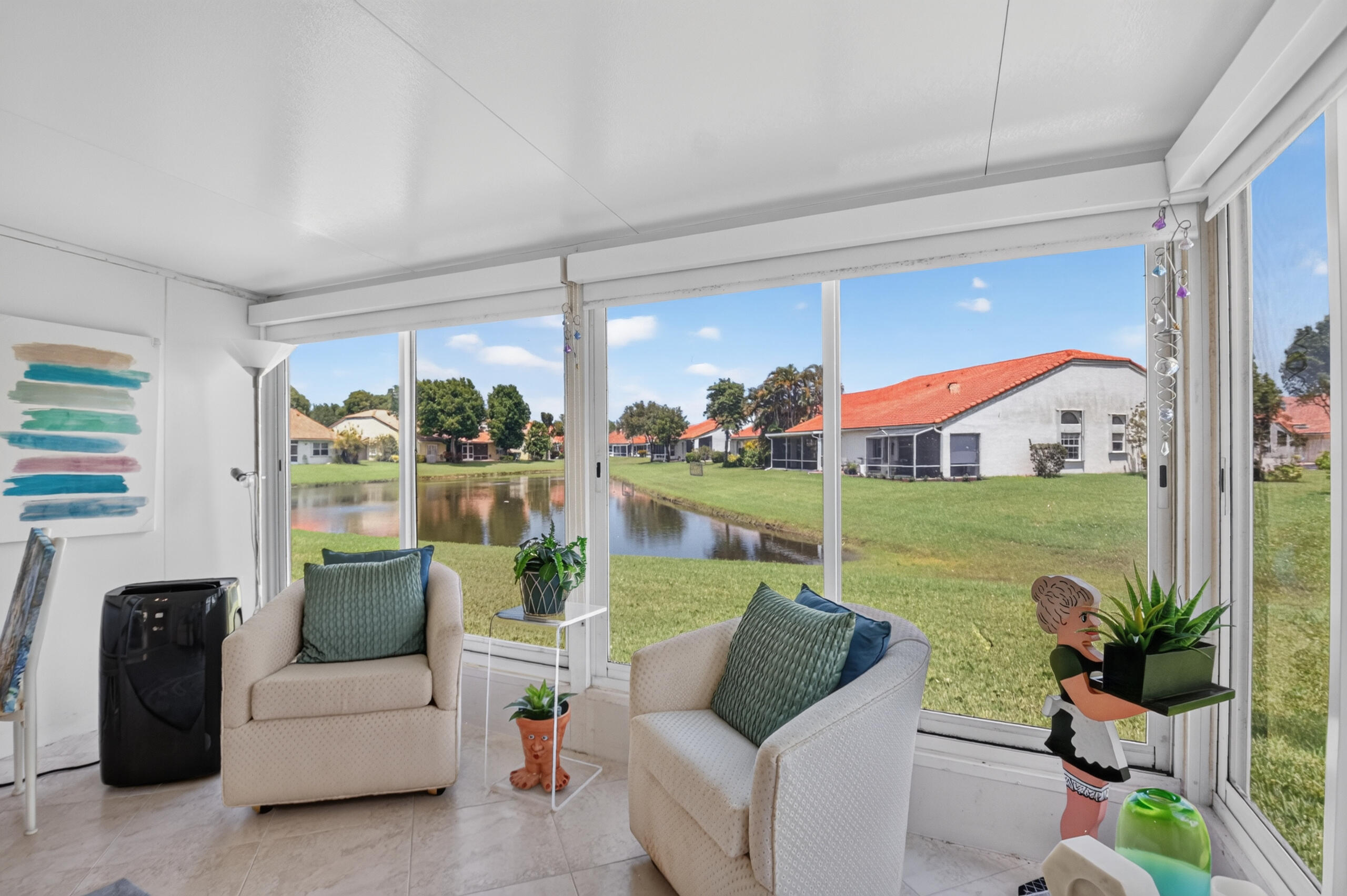 15340 Floral Club Road Delray Beach, FL 33484 - Photo 19 of 42 a living room with patio furniture and garden view