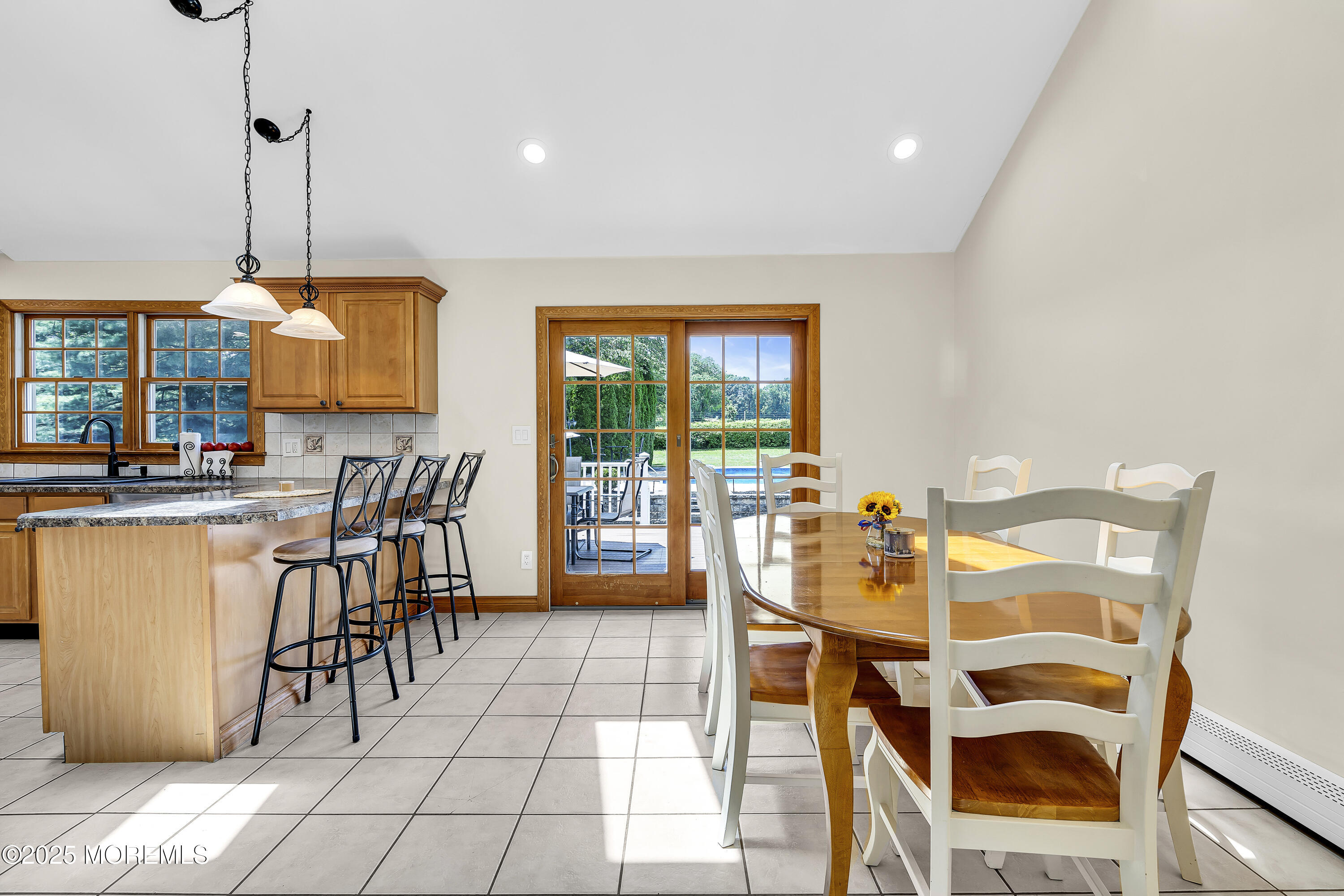 40 Centerville Road Holmdel, NJ 07733 - Photo 16 of 60 a view of a dining room with furniture and chandelier