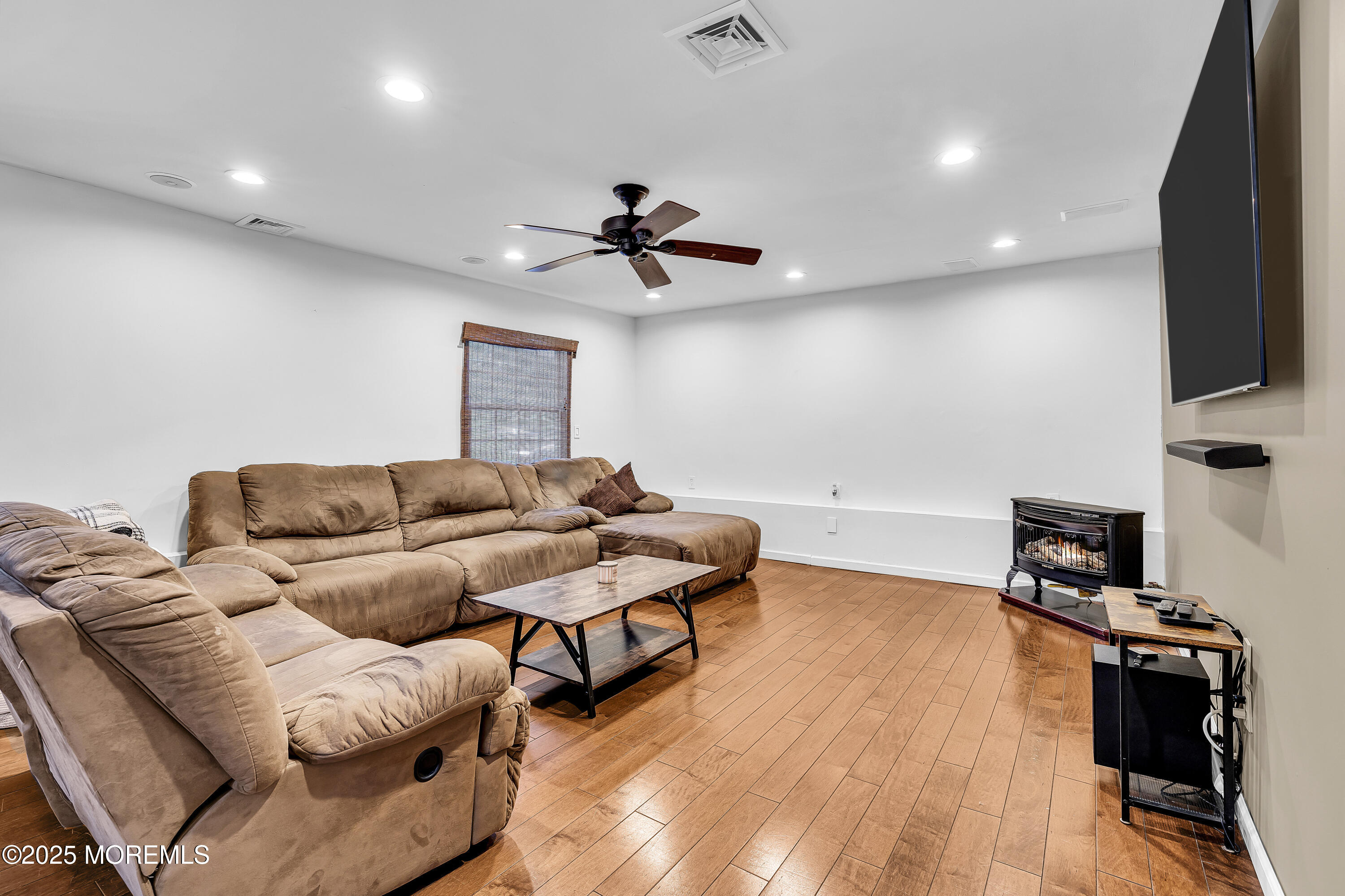 40 Centerville Road Holmdel, NJ 07733 - Photo 19 of 60 a living room with furniture and a wooden floor
