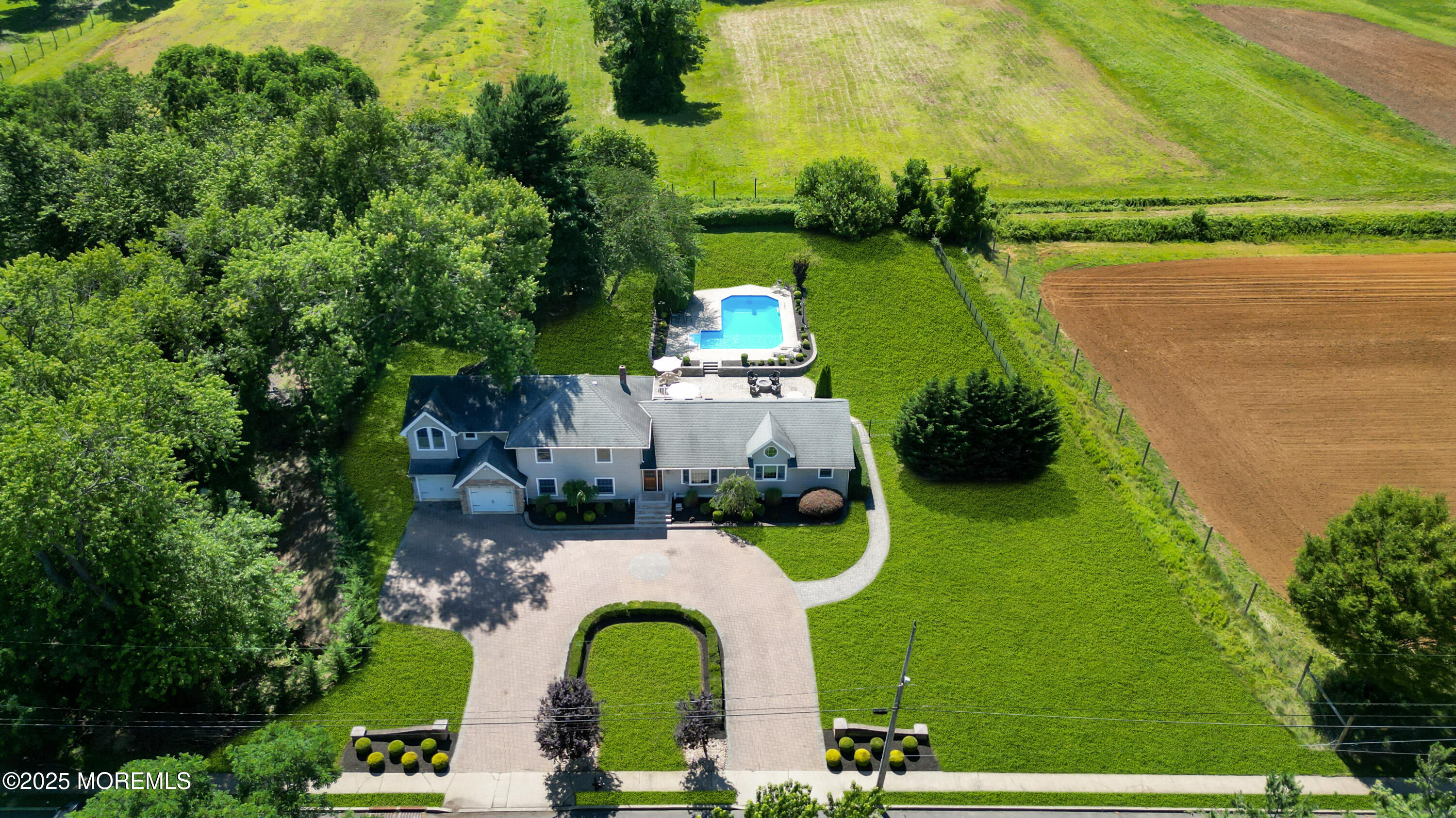 40 Centerville Road Holmdel, NJ 07733 - Photo 2 of 60 an aerial view of a house with swimming pool garden and patio