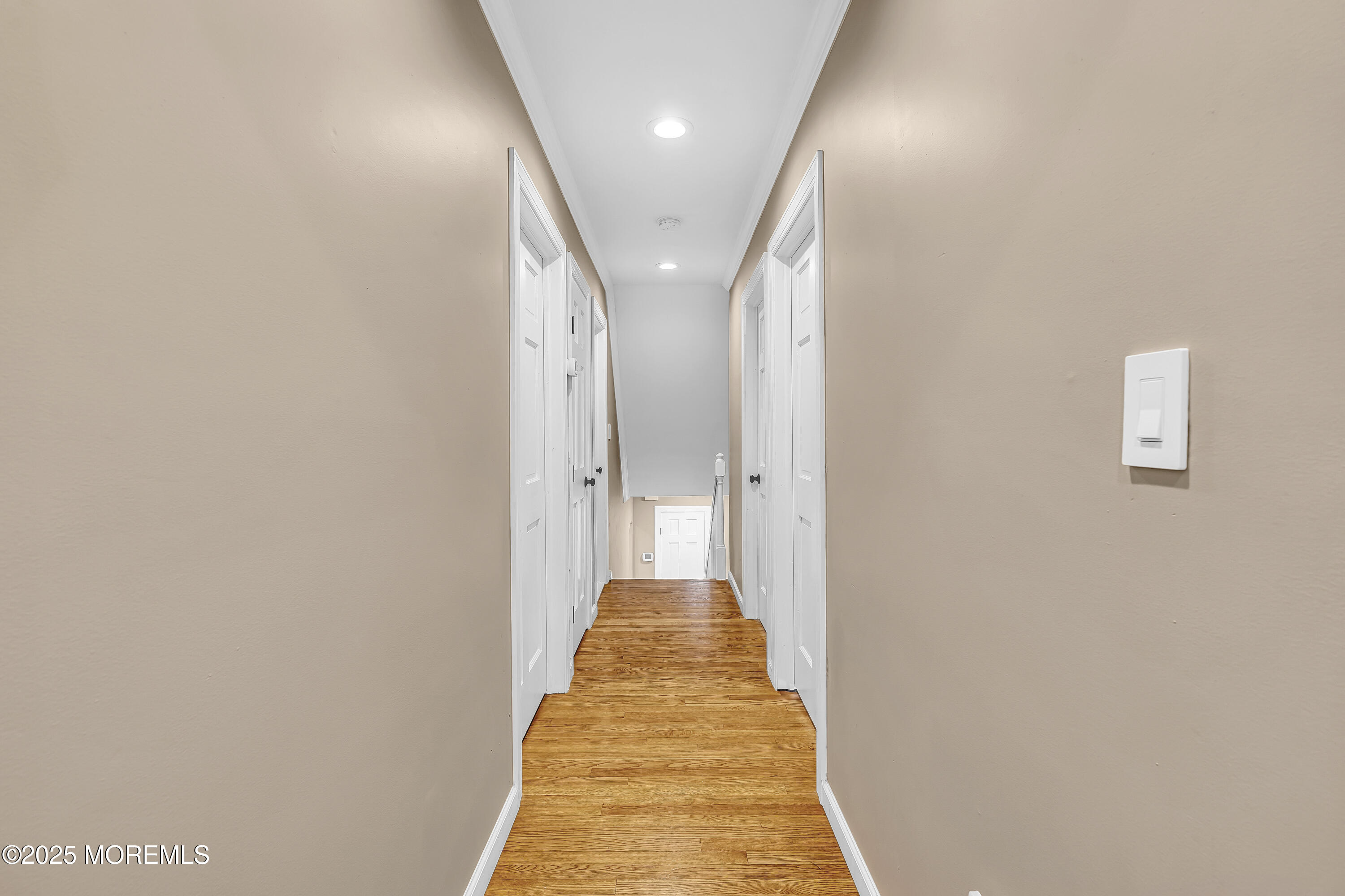 40 Centerville Road Holmdel, NJ 07733 - Photo 21 of 60 a view of a hallway with a white walls