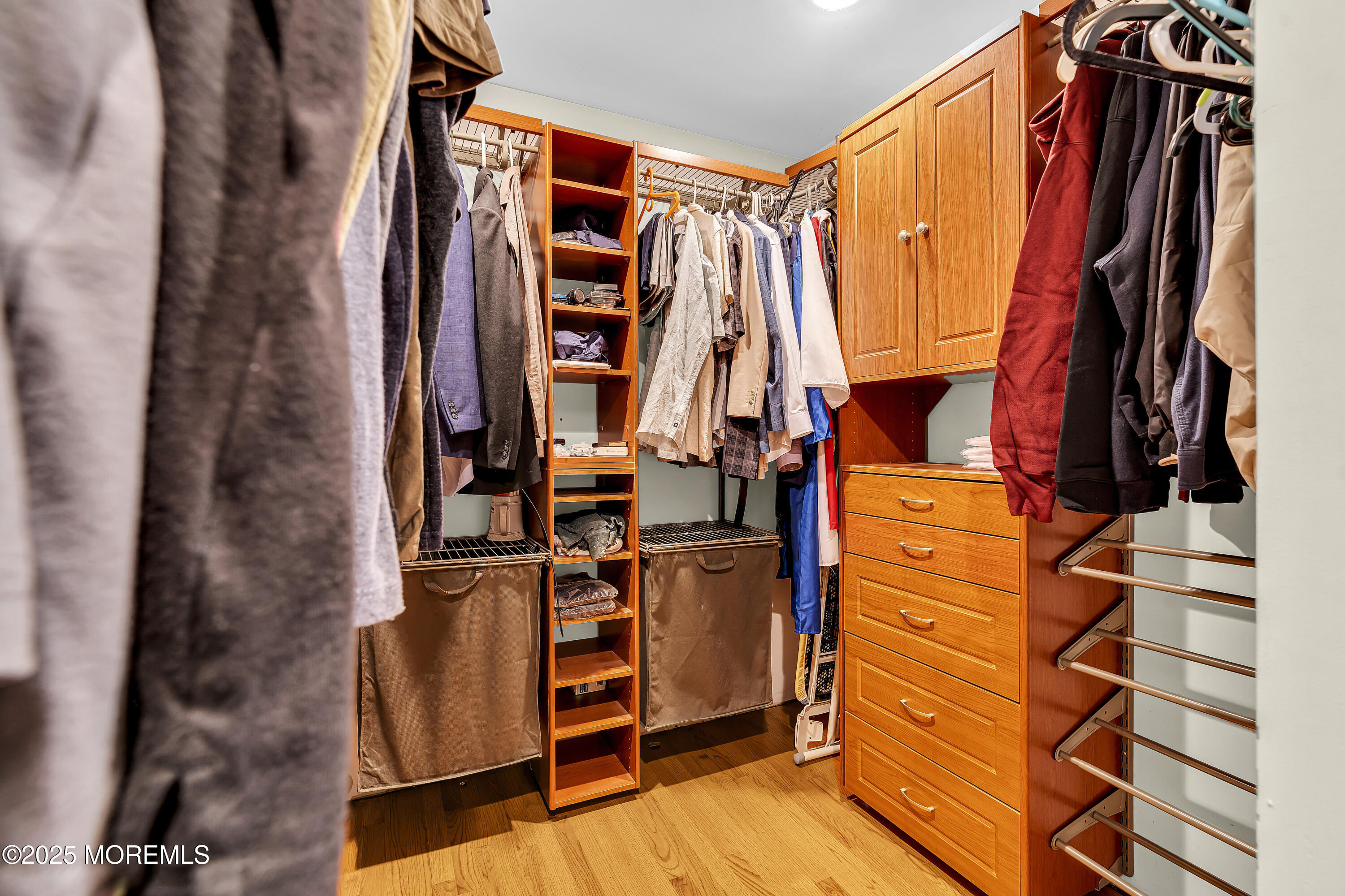 40 Centerville Road Holmdel, NJ 07733 - Photo 31 of 60 walk in closet with clothes and shoes