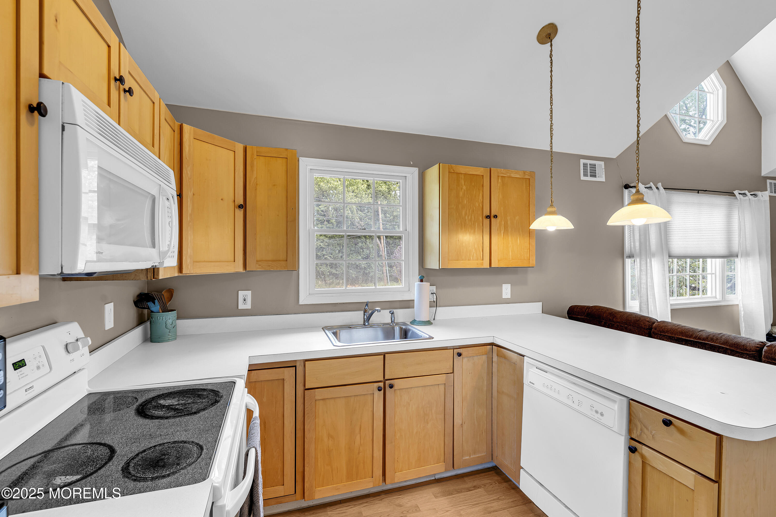 40 Centerville Road Holmdel, NJ 07733 - Photo 41 of 60 a kitchen with a sink a stove and a window