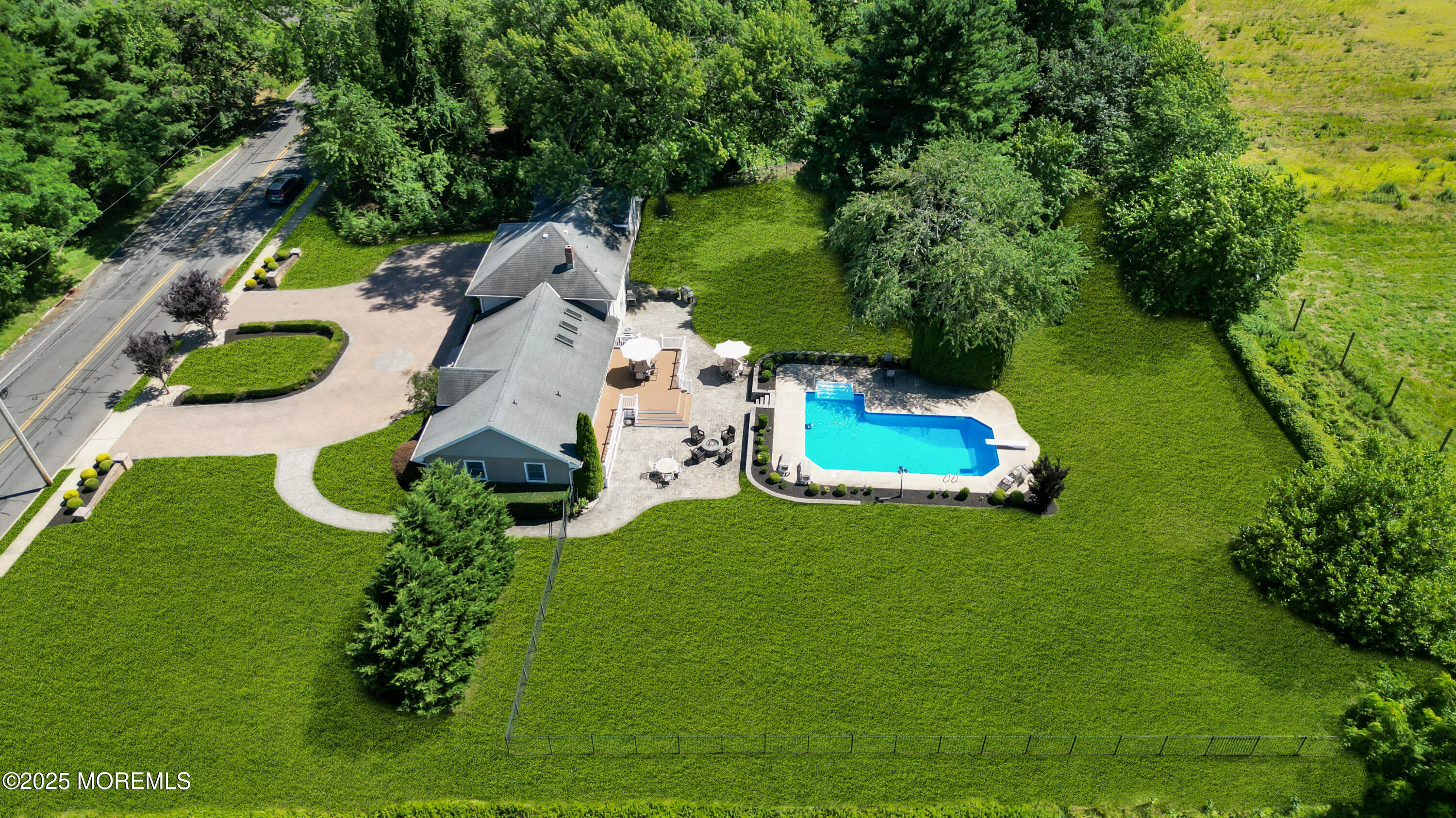 40 Centerville Road Holmdel, NJ 07733 - Photo 49 of 60 an aerial view of a house with a garden