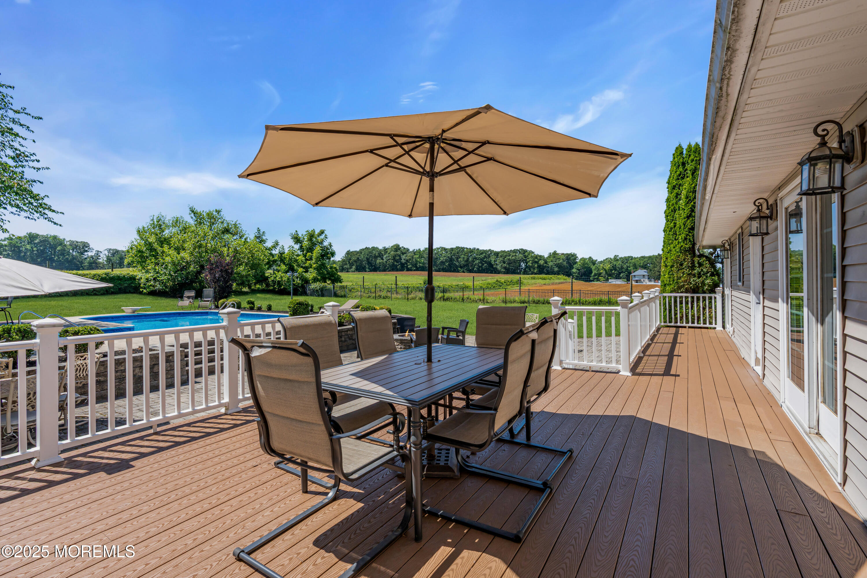 40 Centerville Road Holmdel, NJ 07733 - Photo 52 of 60 a view of a chair and table on the deck