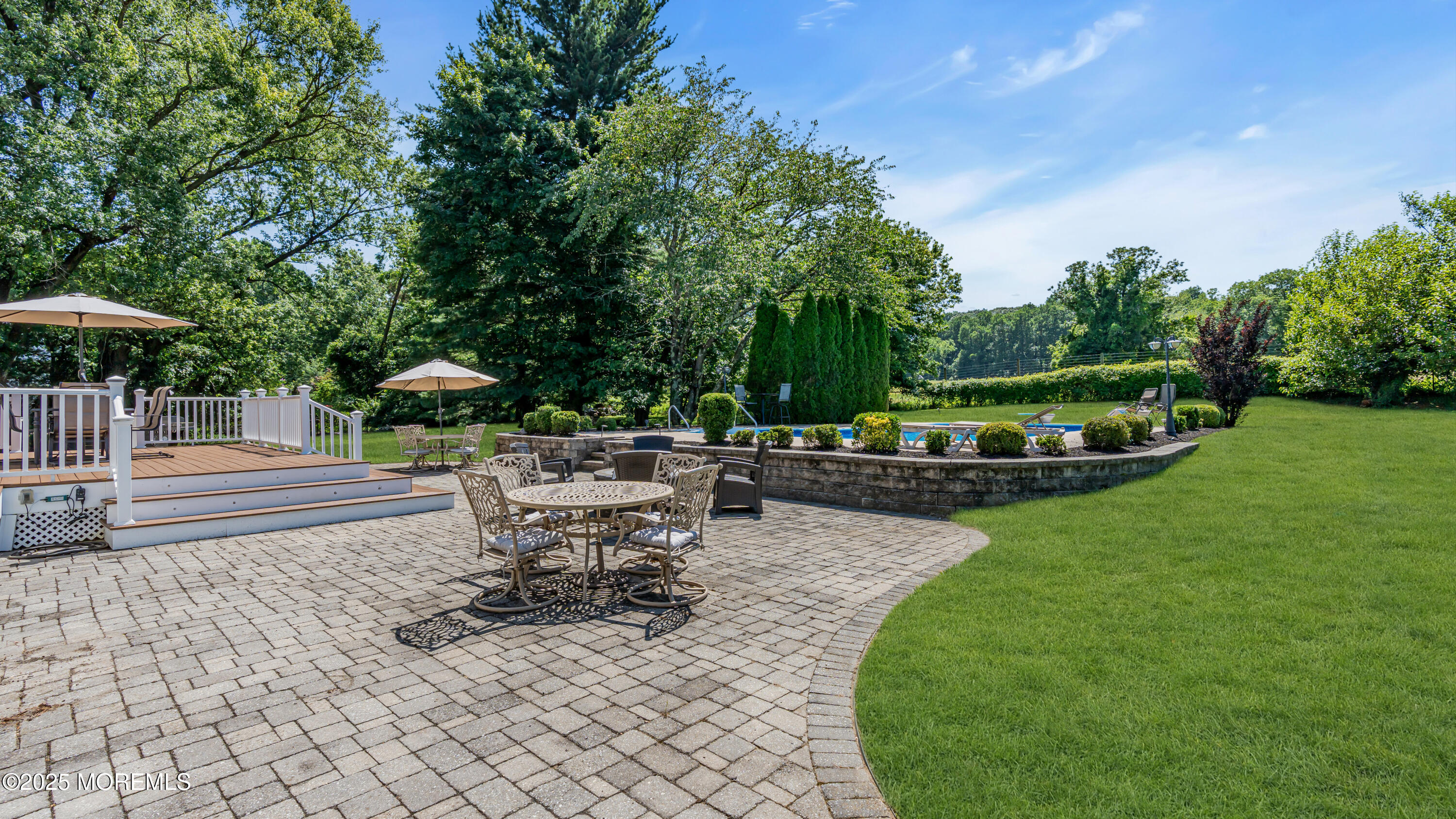 40 Centerville Road Holmdel, NJ 07733 - Photo 57 of 60 an outdoor space with patio and wooden fence